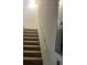 Carpeted staircase with white walls at 3785 Somerset Sw Dr, Marietta, GA 30064