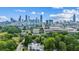 Amazing aerial view of the city skyline, with a modern home nestled in the trees below at 536 Highland Ne Ave # A, Atlanta, GA 30312