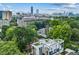 Breathtaking aerial view of a modern home, surrounded by lush trees, with the city skyline in the distance at 536 Highland Ne Ave # A, Atlanta, GA 30312