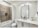 Modern bathroom featuring a sleek vanity, black faucet and a shower with grey tiling at 536 Highland Ne Ave # A, Atlanta, GA 30312