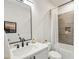 Contemporary bathroom featuring a sleek vanity, black faucet and a shower with gray tiling at 536 Highland Ne Ave # A, Atlanta, GA 30312