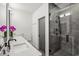 Modern bathroom featuring double vanity sinks and a glass-enclosed shower at 536 Highland Ne Ave # A, Atlanta, GA 30312