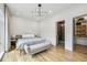 Modern bedroom with hardwood floors, bench, and closet at 536 Highland Ne Ave # A, Atlanta, GA 30312