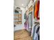 A well-organized walk-in closet boasts custom shelving, ample storage space, and hardwood floors at 536 Highland Ne Ave # A, Atlanta, GA 30312