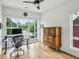 Bright home office with natural light, a modern desk setup, wood floors and a vintage storage cabinet at 536 Highland Ne Ave # A, Atlanta, GA 30312