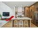 Open kitchen with a large island, modern appliances, and seamless transition to the living area at 536 Highland Ne Ave # A, Atlanta, GA 30312