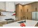 Gourmet kitchen with stainless steel appliances, a tile backsplash, and open shelving at 536 Highland Ne Ave # A, Atlanta, GA 30312