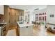 Modern kitchen with a large island, stainless steel appliances, and an adjoining dining area at 536 Highland Ne Ave # A, Atlanta, GA 30312