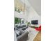 Bright living room with hardwood floors, large windows, and modern light fixture at 536 Highland Ne Ave # A, Atlanta, GA 30312