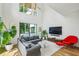 Bright living room featuring hardwood floors, large windows, and comfortable seating at 536 Highland Ne Ave # A, Atlanta, GA 30312