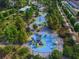 Aerial view of a colorful playground with various play structures and lush landscaping at 536 Highland Ne Ave # A, Atlanta, GA 30312