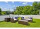 Relax on this rooftop patio, complete with modern outdoor furniture, lush green turf and views of the city at 536 Highland Ne Ave # A, Atlanta, GA 30312