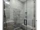 Modern glass shower with bench and gray tiling at 536 Highland Ne Ave # A, Atlanta, GA 30312
