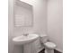 Clean, well-lit powder room featuring a pedestal sink and tiled floors at 1410 Aura Ln, Lawrenceville, GA 30045