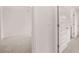Hallway with carpet floors and white trim and doors at 1410 Aura Ln, Lawrenceville, GA 30045