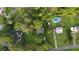 Expansive aerial view of the property with a pool, mature trees, and surrounding neighborhood at 233 Oakridge Se Dr, Cartersville, GA 30121