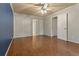 Bedroom with wood floors, ceiling fan, and double closets at 233 Oakridge Se Dr, Cartersville, GA 30121