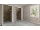 Bedroom featuring a large closet and a window at 233 Oakridge Se Dr, Cartersville, GA 30121