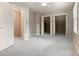 Bedroom with carpeted floors, multiple closets, and natural light at 233 Oakridge Se Dr, Cartersville, GA 30121