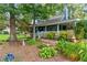 Charming home with a porch, lush landscaping, and a well-maintained garden at 233 Oakridge Se Dr, Cartersville, GA 30121