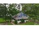 Charming home with a wraparound porch, lush landscaping, and a well-maintained lawn at 233 Oakridge Se Dr, Cartersville, GA 30121
