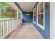 Covered front porch with white railings and blue siding at 233 Oakridge Se Dr, Cartersville, GA 30121