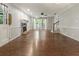 Open living room with hardwood flooring, fireplace, and staircase access at 233 Oakridge Se Dr, Cartersville, GA 30121