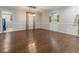 Bright open living room with hardwood floors and view to the nearby laundry room at 233 Oakridge Se Dr, Cartersville, GA 30121