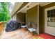 Relax and unwind on this covered porch, perfect for outdoor dining and entertaining at 2430 Tribble Creek Cv, Grayson, GA 30017