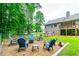Inviting backyard with fire pit and seating area, ideal for entertaining outdoors at 2430 Tribble Creek Cv, Grayson, GA 30017