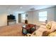 Finished basement with a sofa, entertainment center and neutral carpet at 2430 Tribble Creek Cv, Grayson, GA 30017