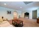 Finished basement with archway, neutral walls, carpet, and access to closet at 2430 Tribble Creek Cv, Grayson, GA 30017