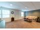 View of a finished basement with a sofa and end tables and neutral walls at 2430 Tribble Creek Cv, Grayson, GA 30017