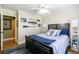 Bedroom with queen bed, nautical decor, and a bright window at 2430 Tribble Creek Cv, Grayson, GA 30017