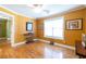 Well-lit bonus room with hardwood floors and neutral tones, perfect for a home office at 2430 Tribble Creek Cv, Grayson, GA 30017