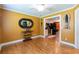 Bonus room with hardwood floors leading into a kitchen, great for entertaining guests at 2430 Tribble Creek Cv, Grayson, GA 30017