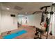 Finished basement exercise room with carpet floors and exercise equipment at 2430 Tribble Creek Cv, Grayson, GA 30017