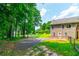 Side yard view showcasing the deck, fencing, and lush green space at 2430 Tribble Creek Cv, Grayson, GA 30017