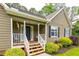 Relax on the cozy covered front porch of this charming home with manicured landscaping at 2430 Tribble Creek Cv, Grayson, GA 30017