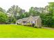 Attractive single story house features well-kept lawn and an attached two car garage at 2430 Tribble Creek Cv, Grayson, GA 30017