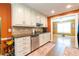 Efficient kitchen with granite countertops and direct access to a bonus room at 2430 Tribble Creek Cv, Grayson, GA 30017
