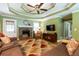 Comfortable living room featuring a stone fireplace and a view into another room at 2430 Tribble Creek Cv, Grayson, GA 30017
