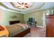 Cozy main bedroom with tray ceilings, neutral walls and carpet, and a calming atmosphere at 2430 Tribble Creek Cv, Grayson, GA 30017