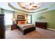 Spacious main bedroom with tray ceilings, neutral walls and carpet, and abundant natural light at 2430 Tribble Creek Cv, Grayson, GA 30017