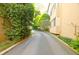 Residential driveway surrounded by mature landscaping, offering a private entrance at 2734 Peachtree Nw Rd # C-404, Atlanta, GA 30305