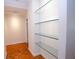 Hallway featuring hardwood floors with floating shelves at 2734 Peachtree Nw Rd # C-404, Atlanta, GA 30305