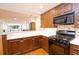 Kitchen has ample storage space with modern appliances at 2734 Peachtree Nw Rd # C-404, Atlanta, GA 30305
