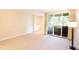 Bright living area featuring sliding glass doors to private deck and built in shelves at 2734 Peachtree Nw Rd # C-404, Atlanta, GA 30305