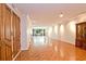 Spacious living room boasts hardwood floors, natural lighting, and detailed trim at 2734 Peachtree Nw Rd # C-404, Atlanta, GA 30305