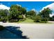 Street view of the neighborhood with landscaped trees and green grass around the residential buildings at 2734 Peachtree Nw Rd # C-404, Atlanta, GA 30305